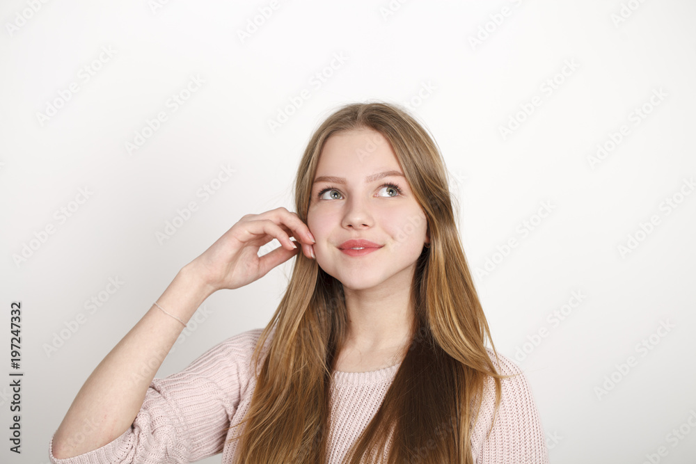 Attractive Blonde Girl with her Hands on her Face Attractive Blonde Girl with her Hands on her Face