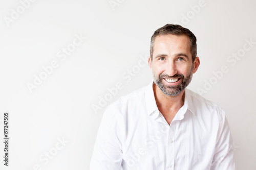 handsome bearded man in white shirt photo