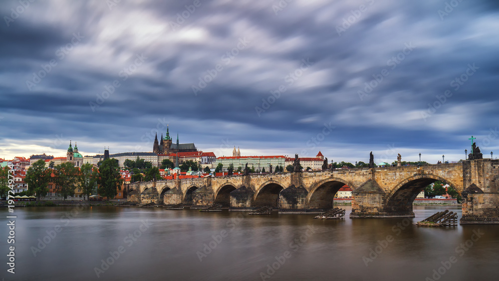 Famous iconic image of Prague castle and Charles Bridge, Prague, Czech Republic. Concept of world travel, sightseeing and tourism.