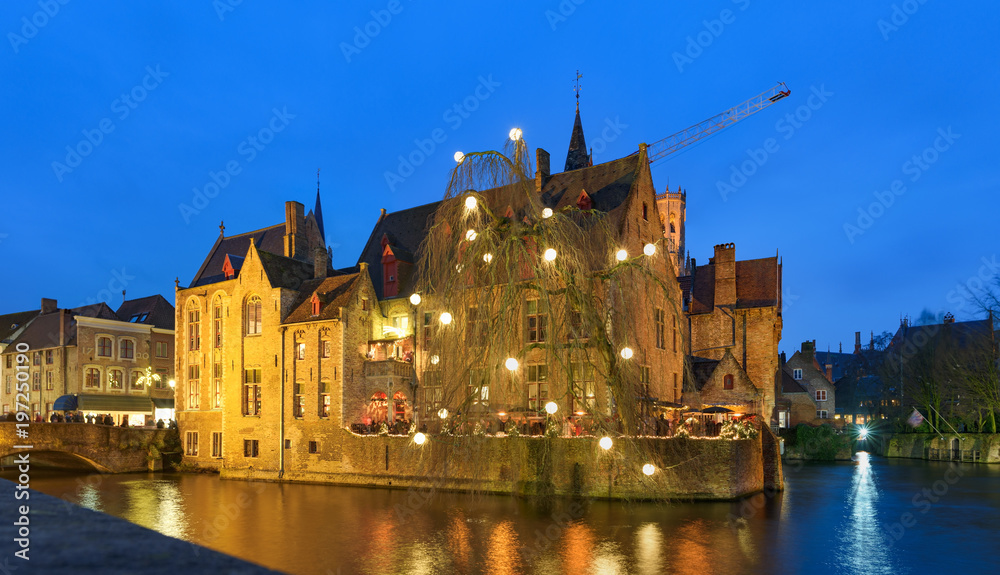 Twilight view of historic medieval centre of Bruges (Brugge), Belgium in Christmas decorations