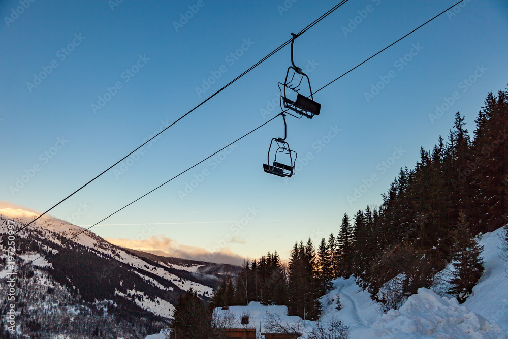Valley view of Meribel ski resort (1450 m.) with chairlift ski lift at early morning, Three Valleys, France