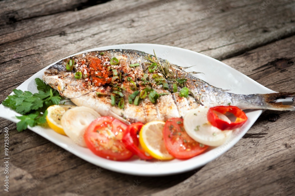 Grilled fish with spices and vegetables Grilled fish with spices and vegetables