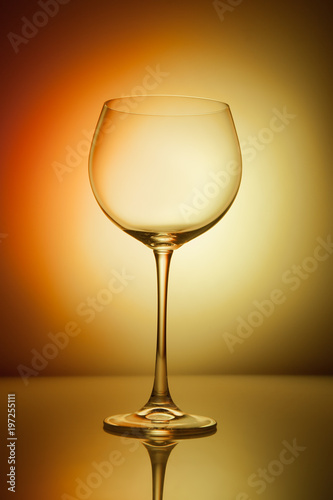 Wine glass blank on colorful abstract background.