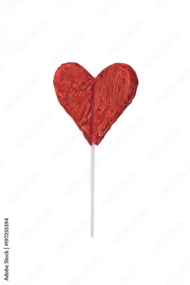 the red Lollipop candy in heart shape onwhite background.