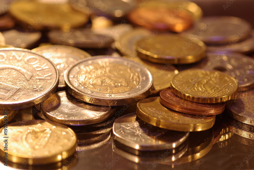 photo of metal coins of different currencies photo of metal coins of different currencies