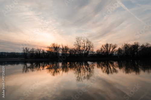 blue cloudy sky sunset reflection on river Danube