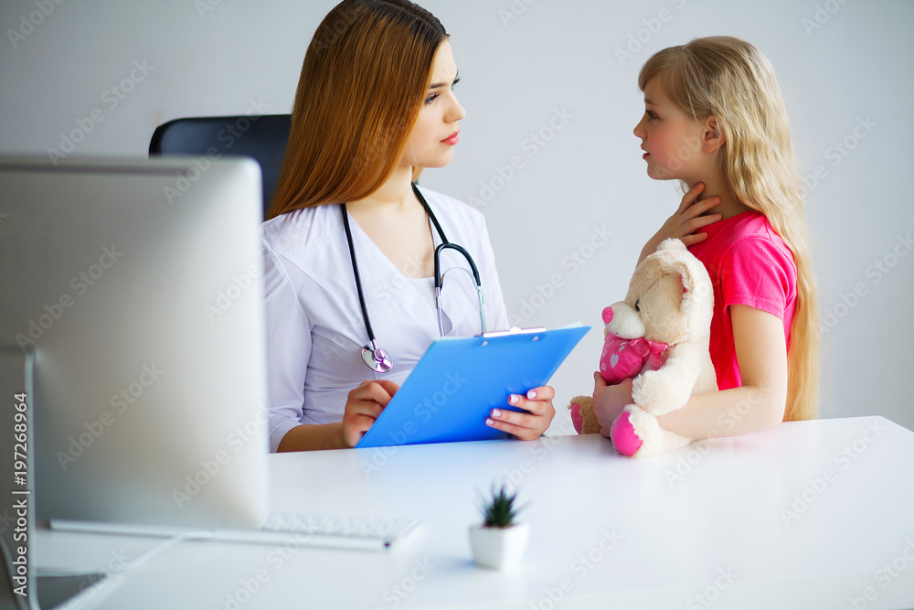 Young smiling female doctor and her little patient with teddy bear. Young smiling female doctor and her little patient with teddy bear.