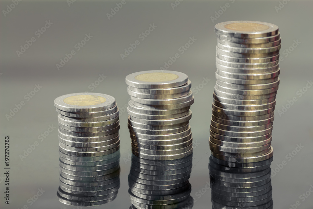 Close up, ten baht coins in Thailand during the reign of King Rama 9 placed stacked. Close up, ten baht coins in Thailand during the reign of King Rama 9 placed stacked.