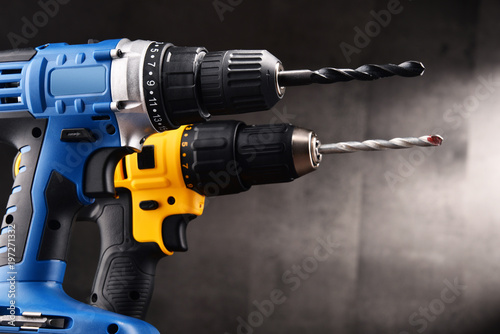 Two cordless drilsl with drill bits working also as screw guns