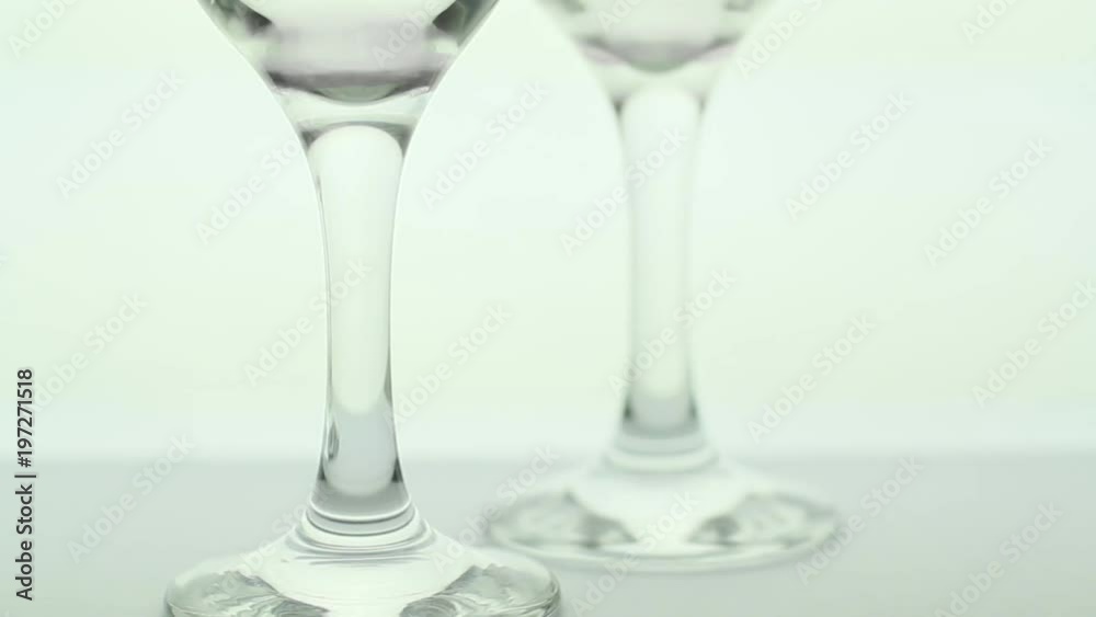 Two empty glass on white light background Two empty glass on white light background