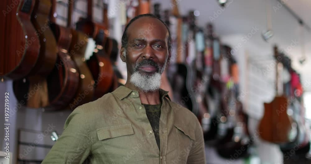 Portrait of a small business owner in a guitar store