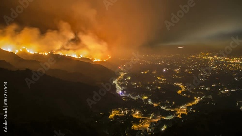 Rescue teams evacuating neighborhood from wildfire - time lapse