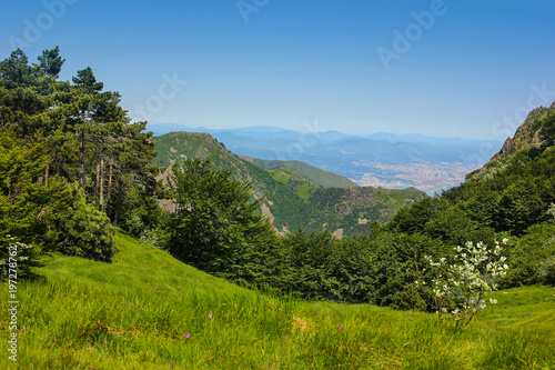 Alpine landscape and city of Genova in the background in Beigua National Geopark, Liguria, Italy