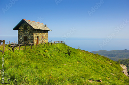 Alpine landscape panorama with refuge cabin in Beigua National Geopark, Liguria, Italy