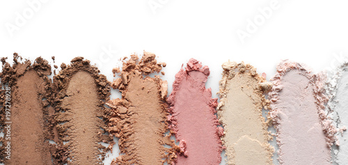 Foto Crushed eye shadows on white background