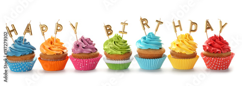 Photography Birthday cupcakes with candles on white background