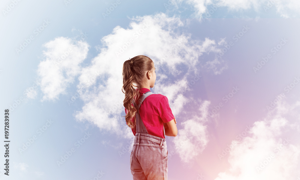Concept of careless happy childhood with girl looking in future Concept of careless happy childhood with girl looking in future