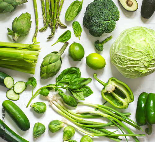 Green vegetables on a wooden background. Healthy food.