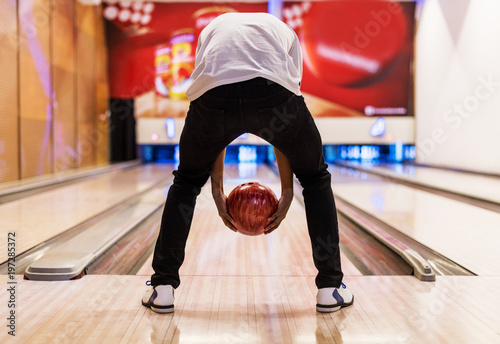 Boy bowling with two hands