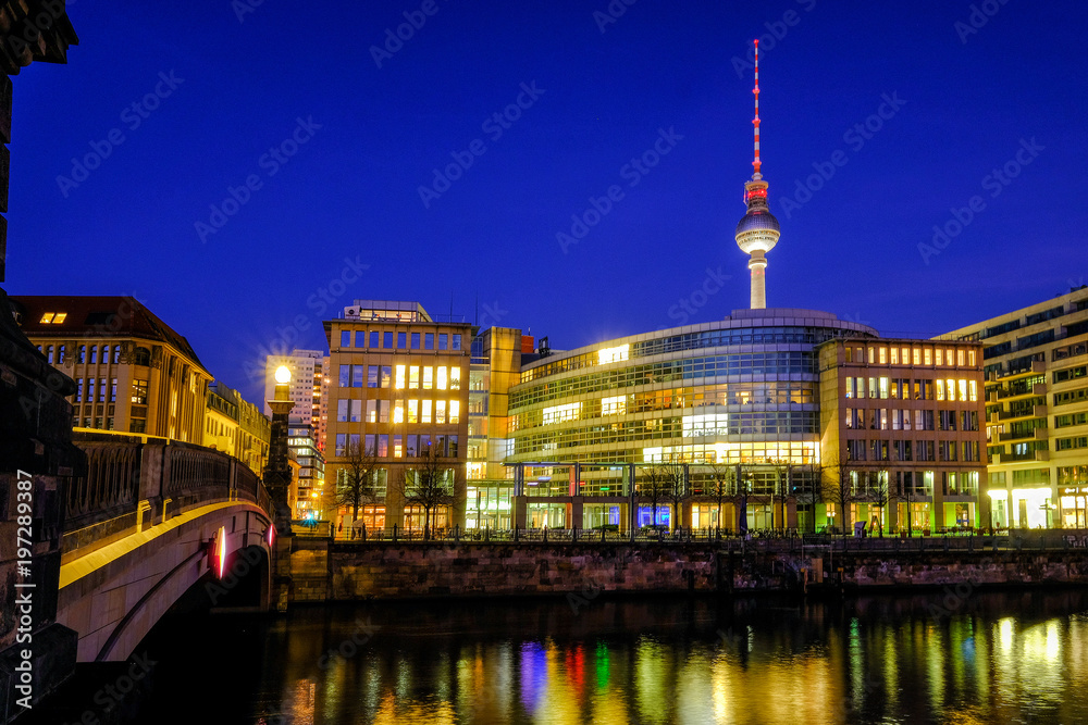 Berlin Tower cityscape on the Spree River in twilight during blue hour at dusk, Germany