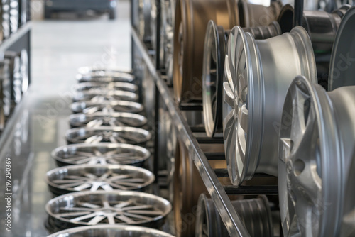 Various alloy wheels in store, selective focus. Car alloy wheels at a wheel shop.