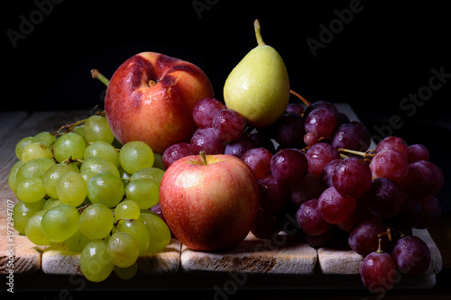 still life of fruits with apples, grapes, pears and peaches