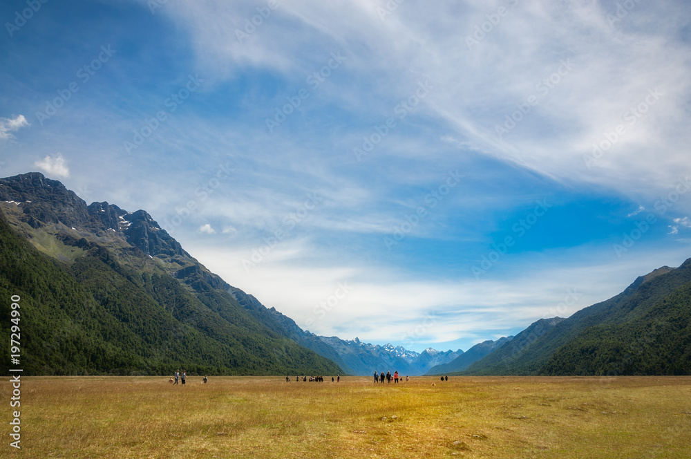 People visiting Elighton Valley on the way to Milford Sound in New Zealand.