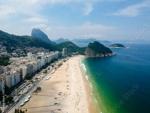 Aerial view of Copacabana beach during summer, sun with clouds