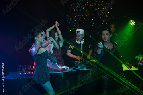 Party young people group dancing in night club © Johnstocker
