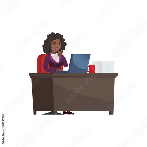 Thoughtful confused ethnic businesswoman sitting and working at laptop.