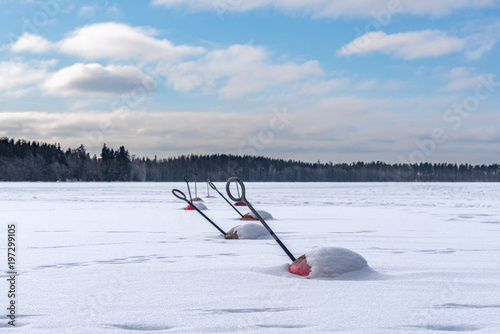 Snowy buoys, frozen lake