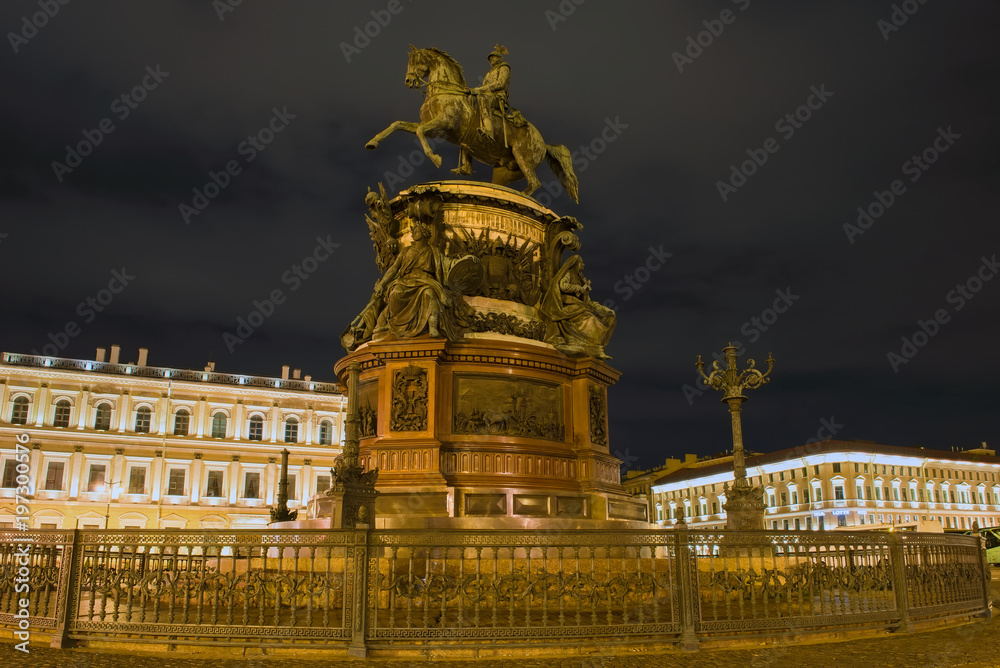RUSSIA, SAINT PETERSBURG - AUGUST 18, 2017:  Monument to Nicholas 1 on St. Isaac's Square, night illumination, long exposure light
