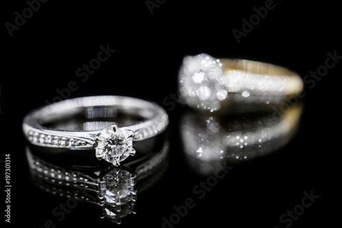 Close up Jewelry diamond ring on black background with reflection