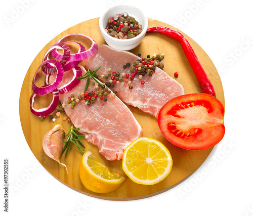 sliced raw meat and vegetables isolated on white