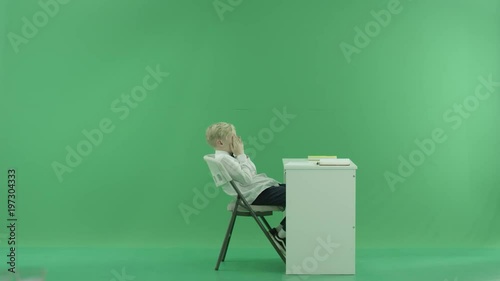 a student wants to sleep on the lesson on the green screen