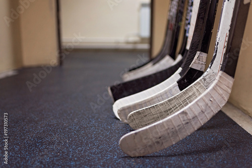 Hockey sticks in locker rooms before the game