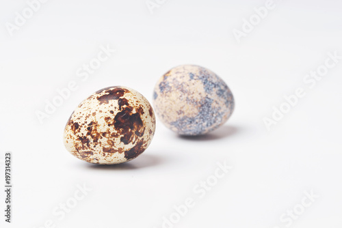 two quail eggs isolated on white background