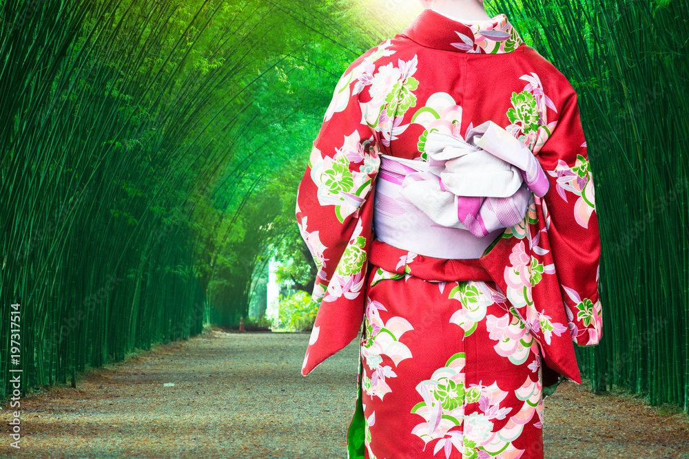 Young woman wearing kimono traditional Japanese at Bamboo Forest.