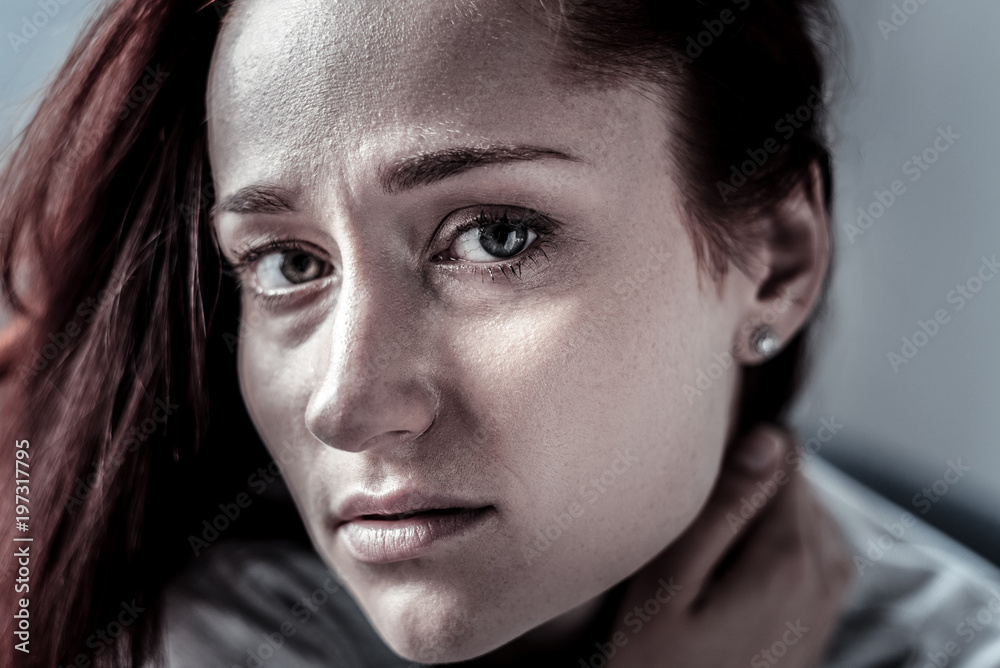 Find the exit. Frustrated lonely upset woman feeling bed herself looking straight ad touching to her neck. Find the exit. Frustrated lonely upset woman feeling bed herself looking straight ad touching to her neck.