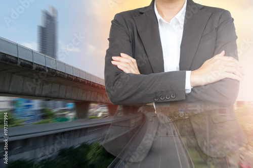 Investment in transportation concept. Business woman with Sky train background.