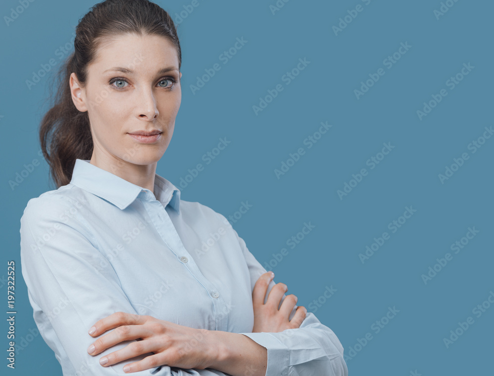 Beautiful confident woman posing with arms crossed Beautiful confident woman posing with arms crossed