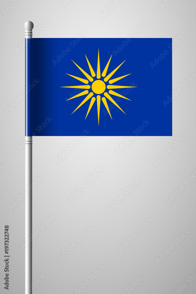 Fototapeta premium The Vergina Sun. Macedonian Flag Unofficial Version. National Flag on Flagpole. Isolated Illustration on Gray