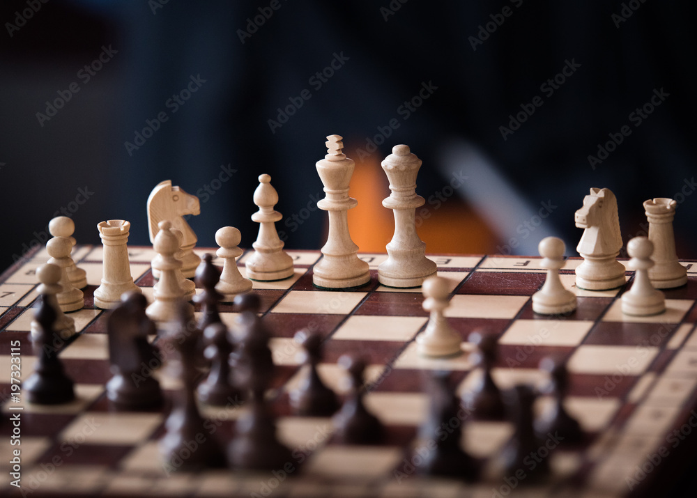 Wooden chess pieces on a chessboard