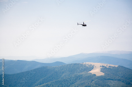 helicopter in the mountains  summer landscape  transport  rescue