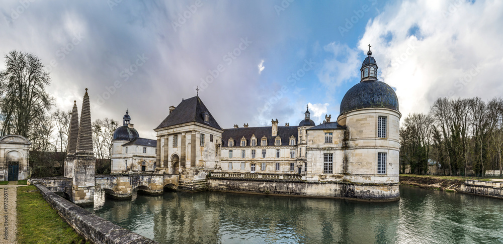 Tanlay castle panoramic view, spring day, cloudy weather, France