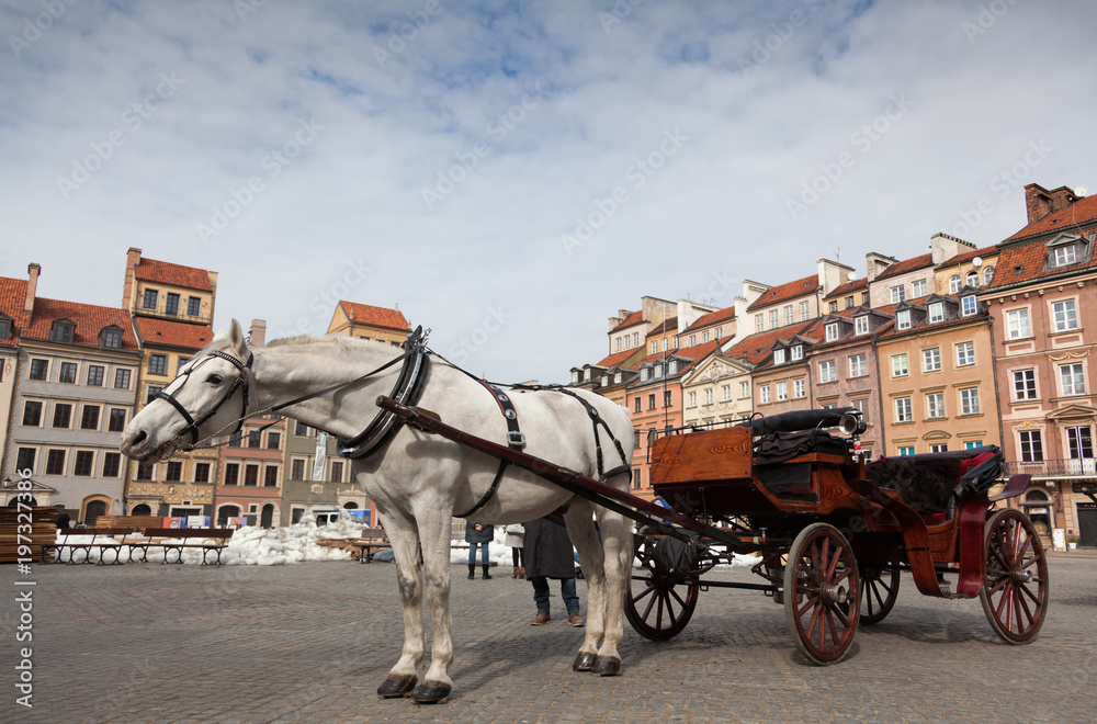 Horse-drawn carriage in front of the Old Town in Warsaw, Poland