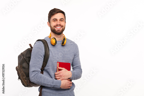 Cheerful male student with backpack photo