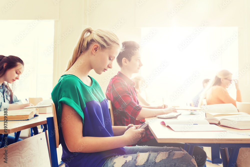 student girl with smartphone texting at school student girl with smartphone texting at school
