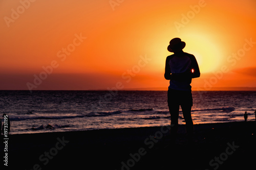 Silhouette Man in hat in sunset beach in Varadero, Cuba