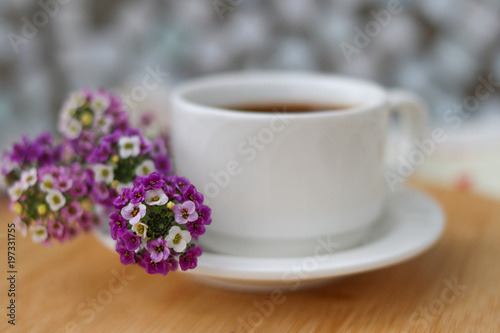 A cup of morning coffee with flowers
